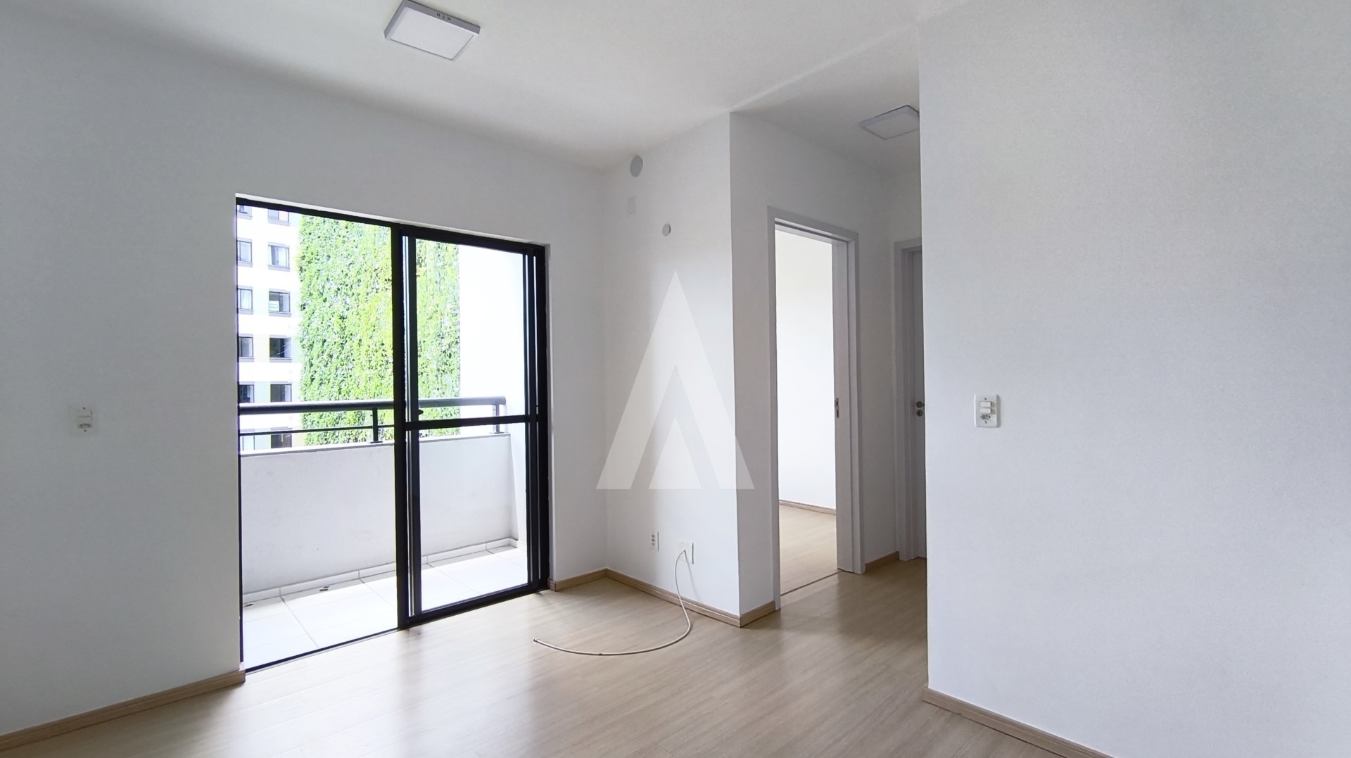 Imóvel Residencial com 2 dormitórios e sacada com churrasqueira e uma vaga de garagem no Bairro Costa e Silva. - foto 1